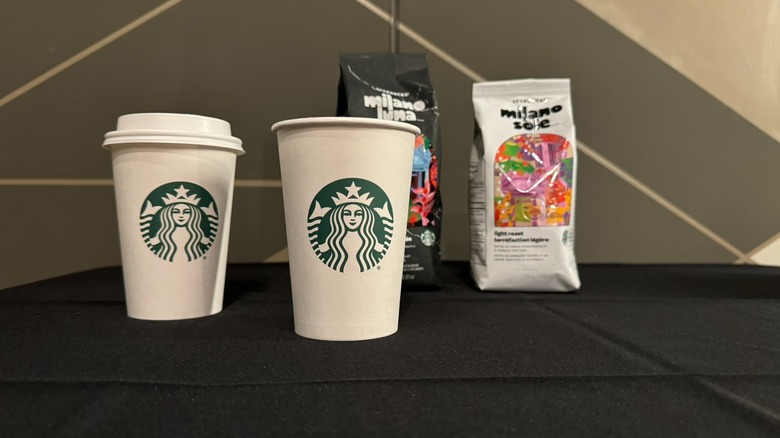 Starbucks cups with bags of Milano Luna and Sole