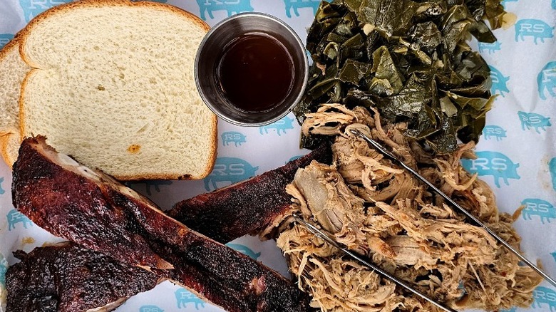 Plate of barbecue, greens, and bread