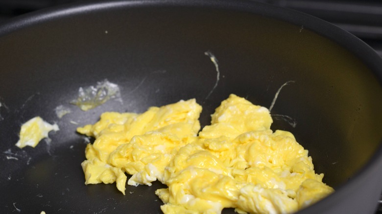 scrambled eggs in frying pan