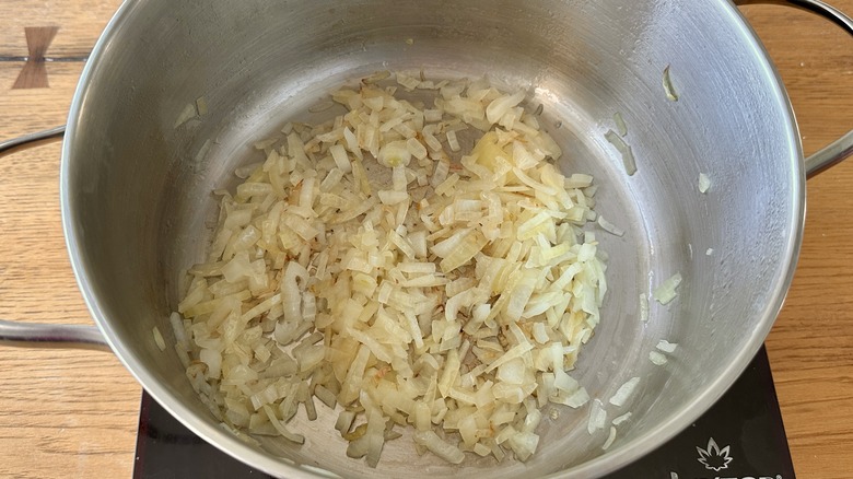 sauteeing diced onion in pot