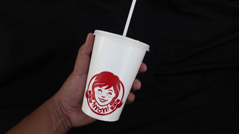 Person holding a Wendy's cup