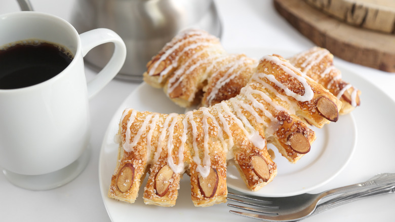 Bear claw pastry with mug of coffee