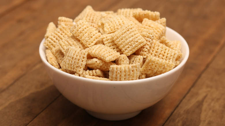 Bowl of Chex cereal on a table.