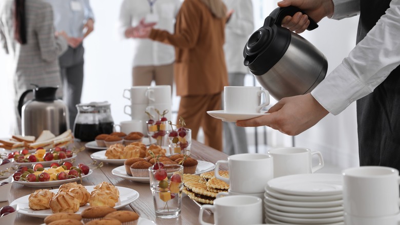 pouring coffee at breakfast buffet