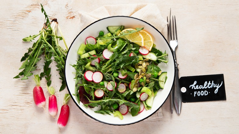 dandelion green salad in bowl