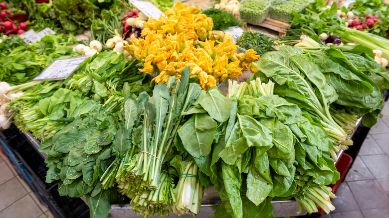 assorted leafy greens at market