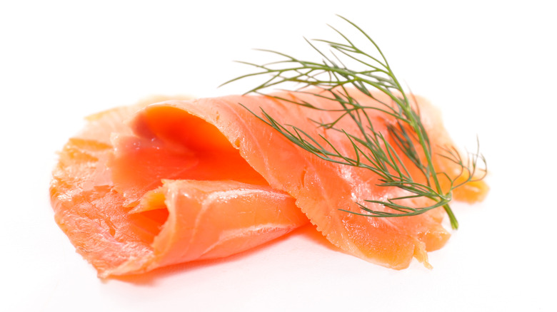 Slice of smoked salmon with dill sprig