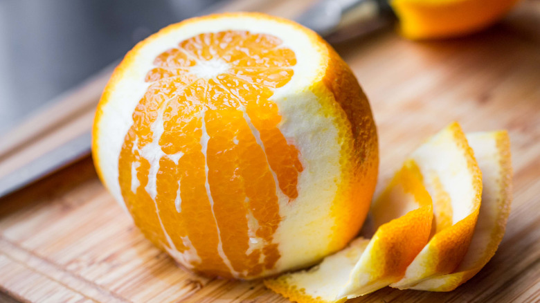 Partly peeled orange