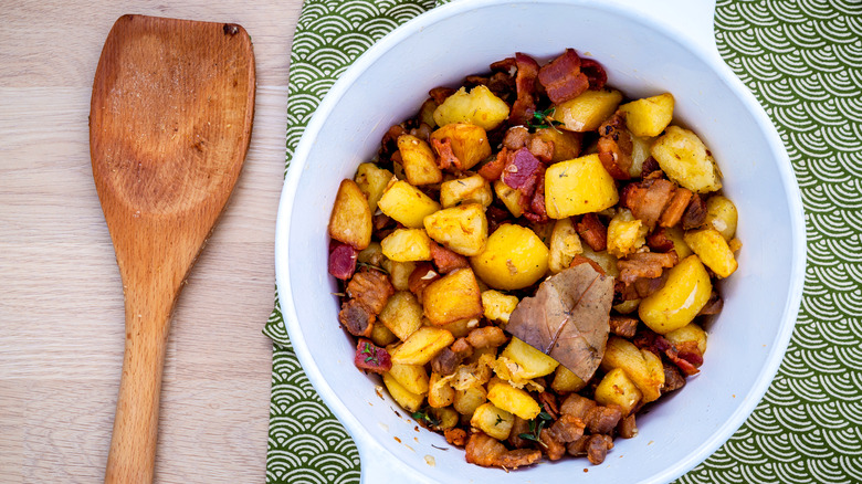 lardons in bowl with potatoes