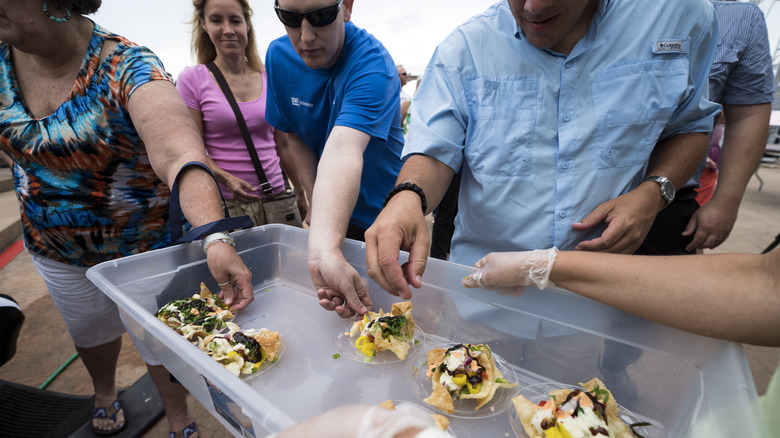 People tasting lionfish