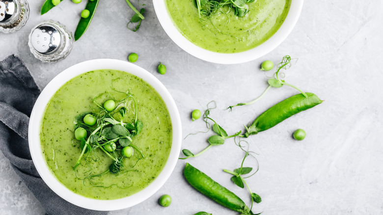 pea soup topped with shoots