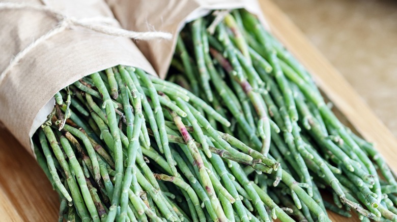 Two paper-wrapped bunches of fresh sea beans