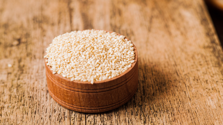 sesame seed in wooden container