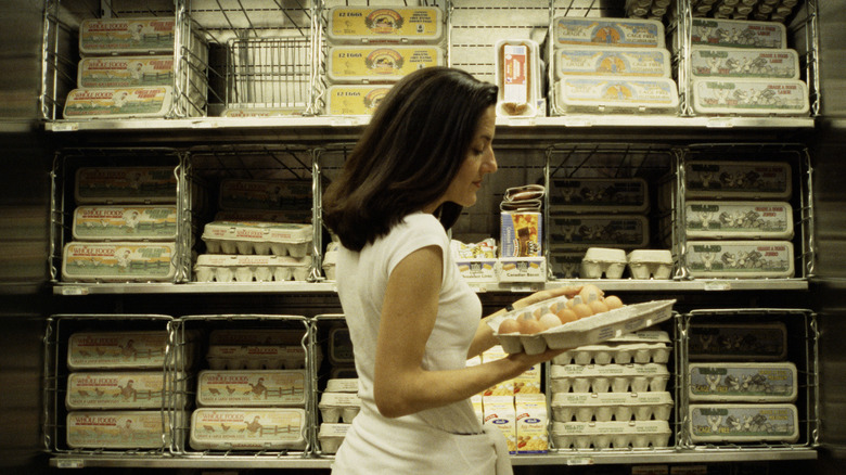 woman holding egg carton