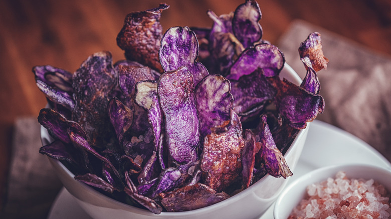 purple potato chips in a bowl