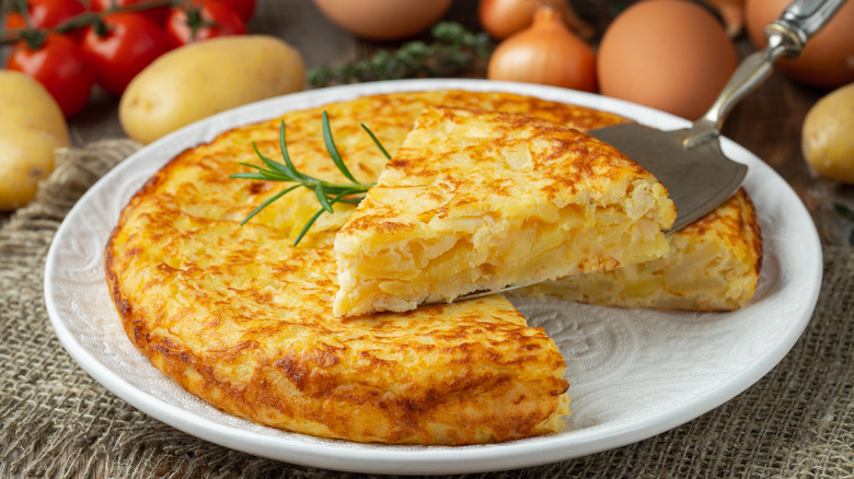 Spanish omelet with serving utensil