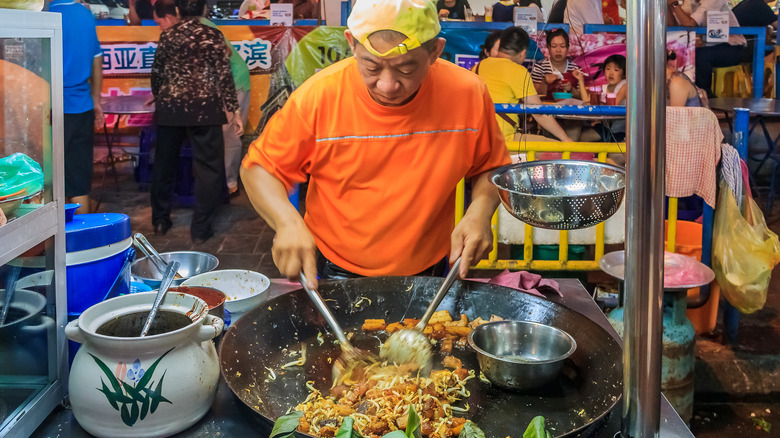 Street vendor cooking stir fry