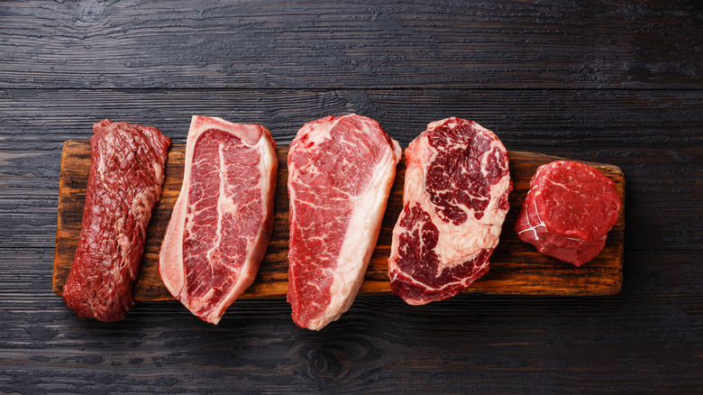 raw steak on a wood board