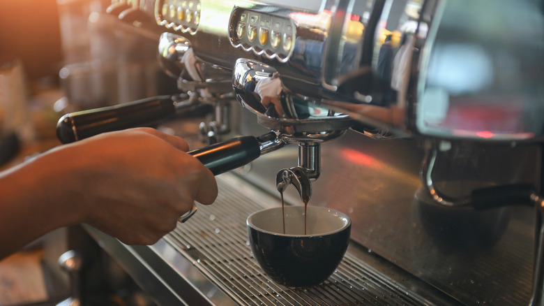 Large coffee machine with mug