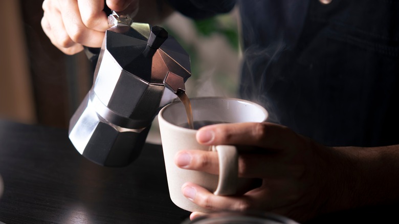 pouring coffee from Moka pot