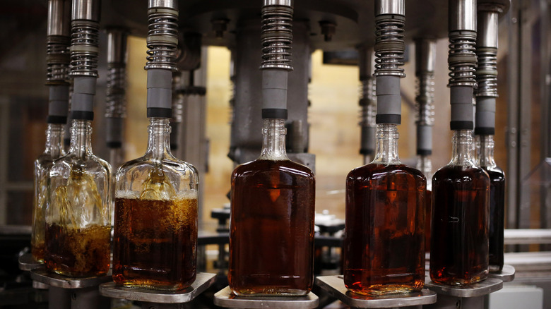 Bourbon distillery bottles being filled