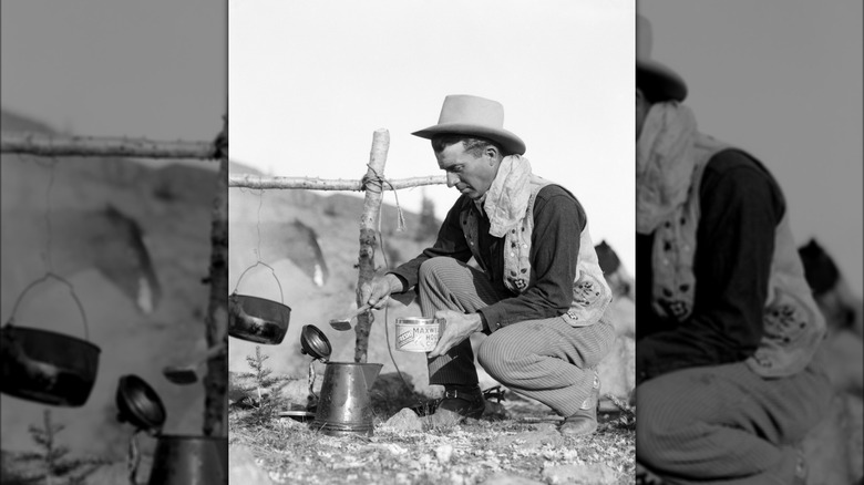 Cowboy pouring ground into pot.