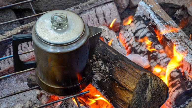 Coffee pot over open fire.