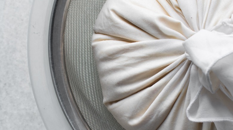 cheesecloth wrapped around yogurt