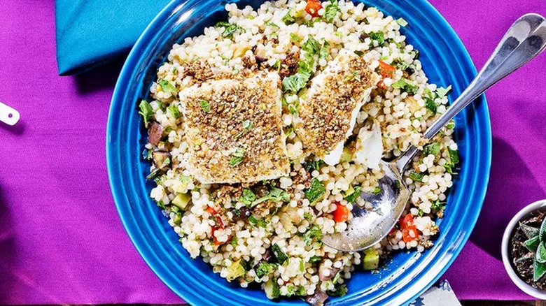 dukkah-crusted fish on couscous