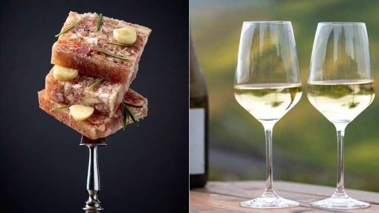 Slices of head cheese on a fork, two white wine glasses and a bottle