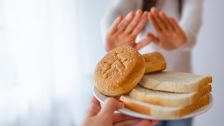 woman shunning bread