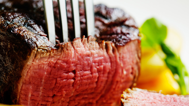 steak being pierced by a fork