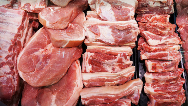 Selection of raw meats all stacked together