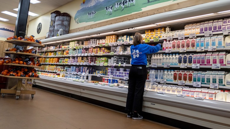 Trader Joe's employee stocking shelves