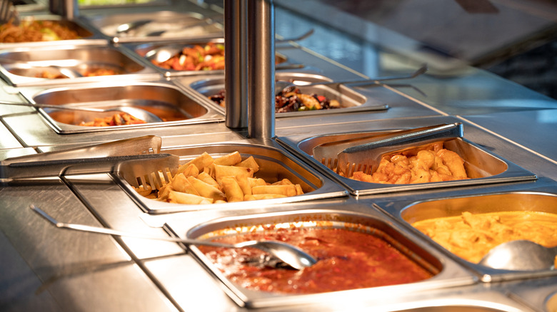 A variety of foods displayed on a buffet line