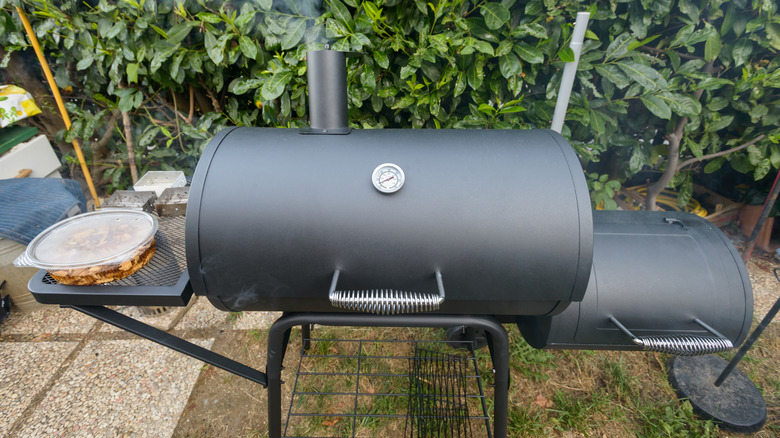 barbecue smoker giving off smoke