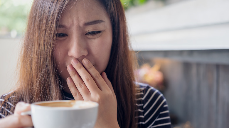 woman holding coffee