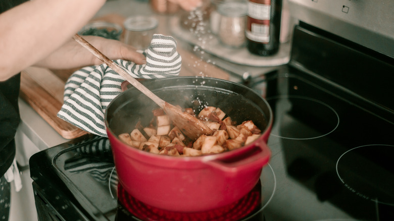 Dutch oven is used on a stove