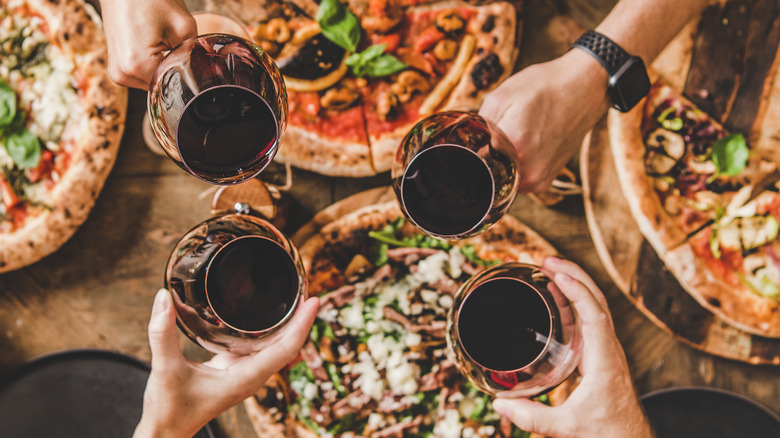 Glasses of wine with pizza