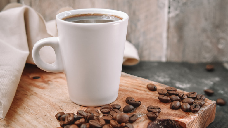 cup of coffee with beans