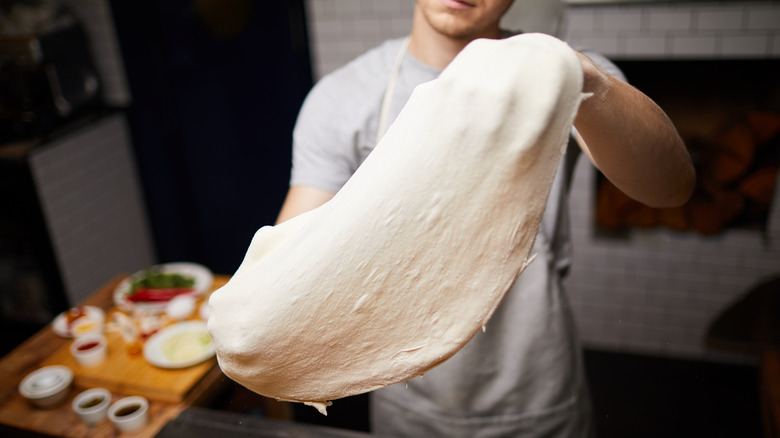 Stretching pizza dough