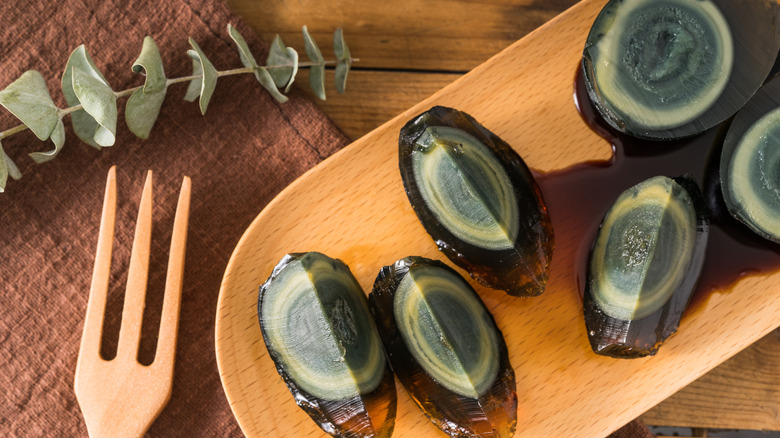 century eggs on a wooden board