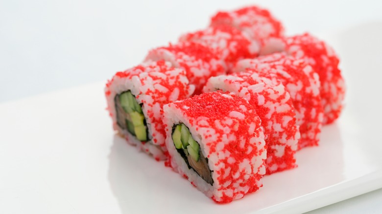 sushi roll topped with tobiko