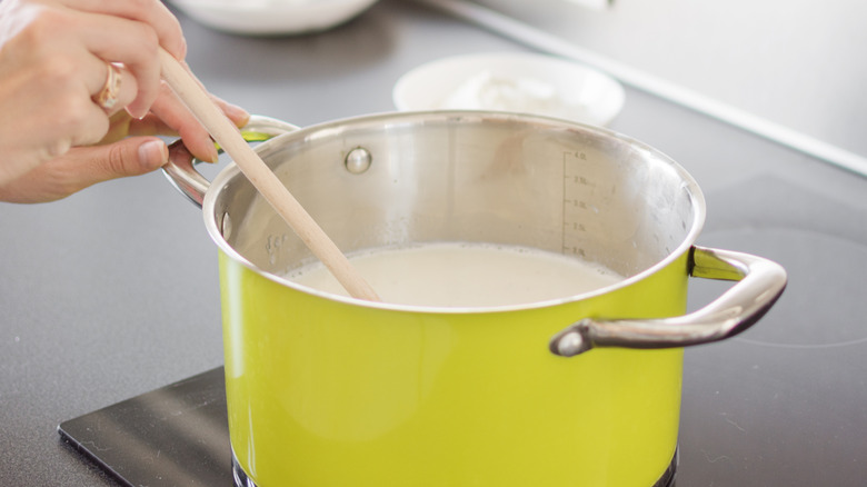 simmering milk in a pot