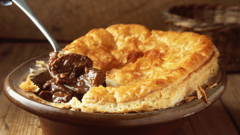 minced meat pie with a spoon