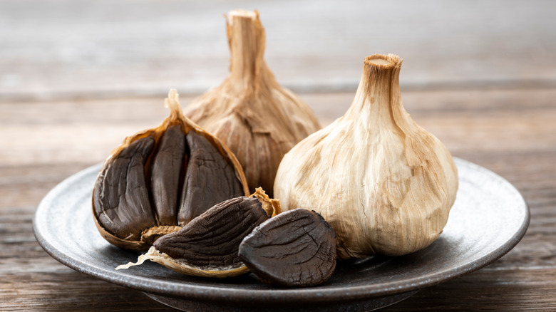 black garlic cloves on plate