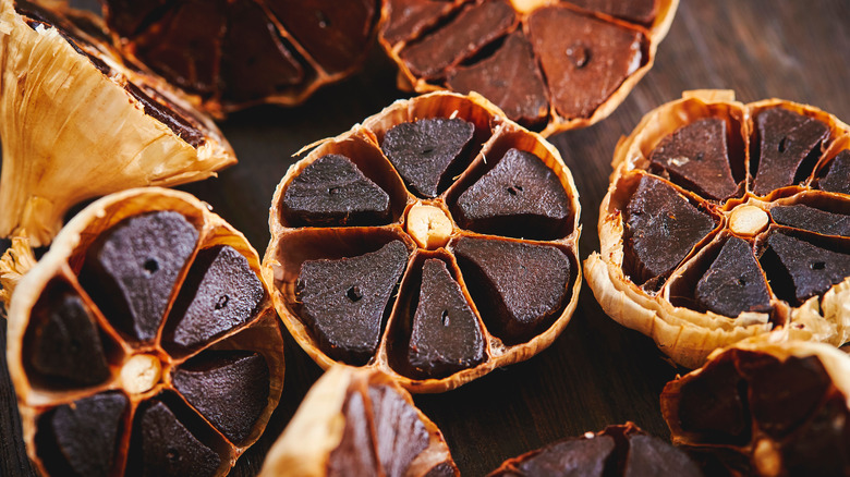 cross sections of black garlic bulbs