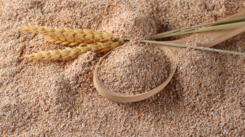 bran flour in bowl with wheat