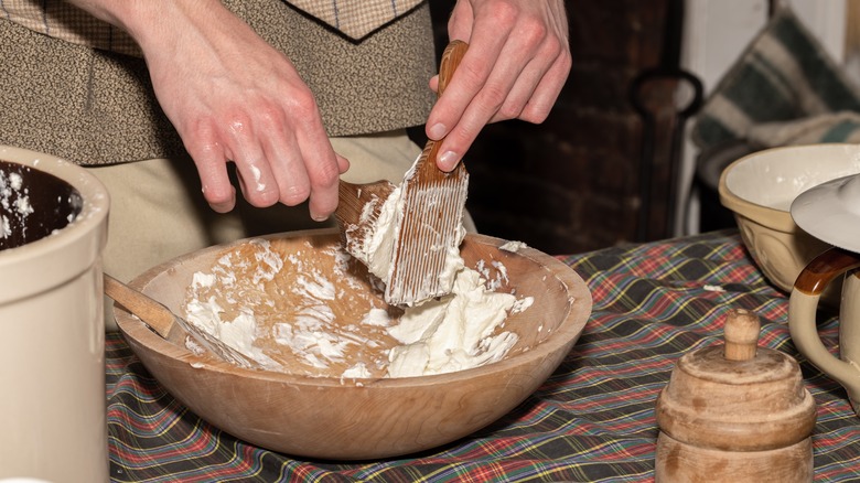 woman separating churned butter