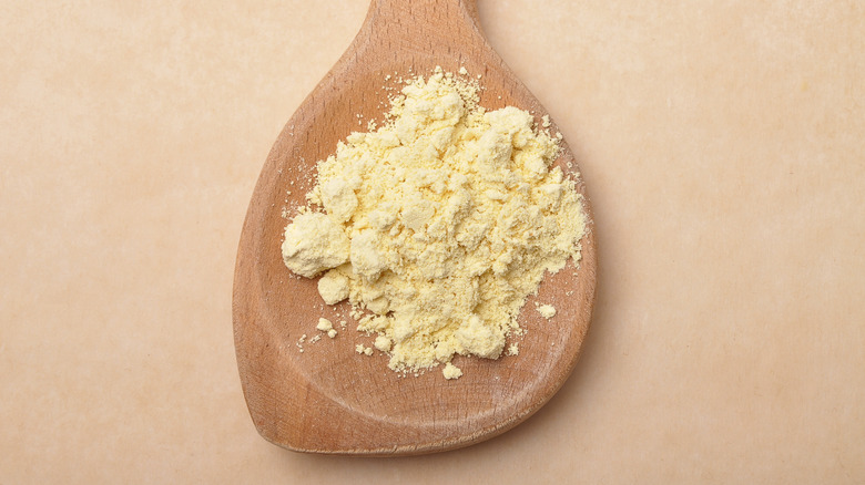 lupin powder on wooden spoon